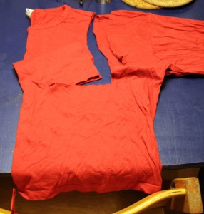 20101216_kjole1 I forgot to take a before picture, but here I've cut out the body of the dress (top left) using a top that fits the lass as a template.